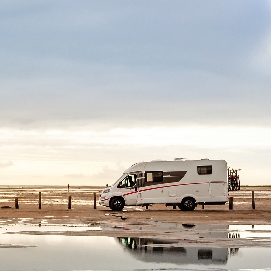 Motorhome on the beach at dusk