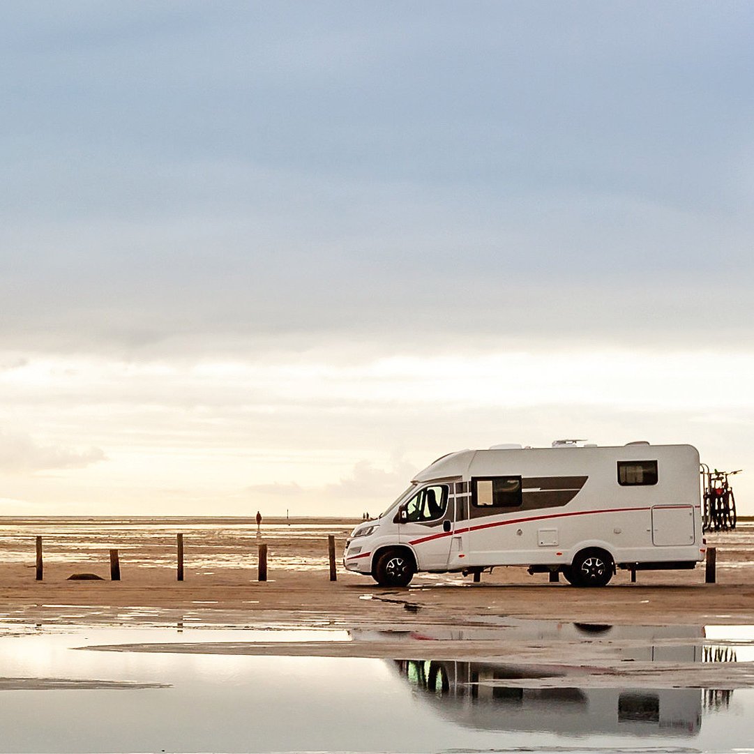 Motorhome on the beach at dusk